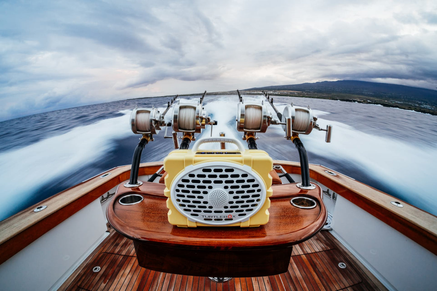 A lifestyle photo of a vintage-style boat engine on a moving boat with a scenic background #base-color_fighting-lady-yellow